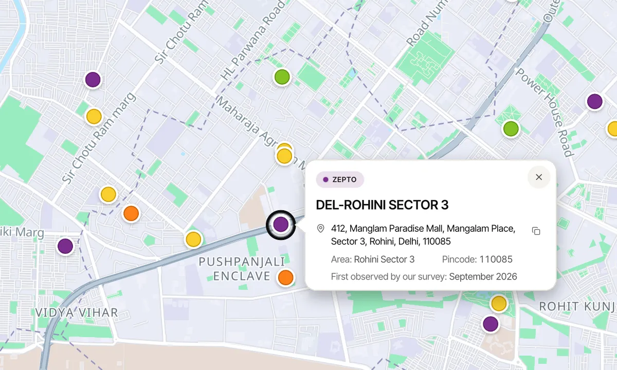 The same streets with a Delhi pass: each store on the map, accurate to about 200 m, and one store's card with its street address